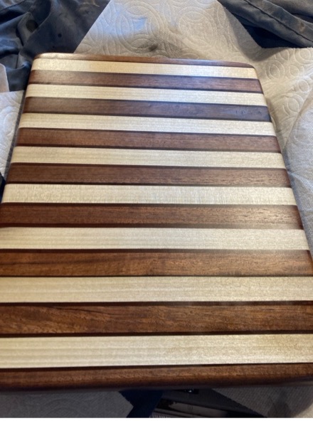 Striped Wood Cutting Board with red resin between pieces of wood